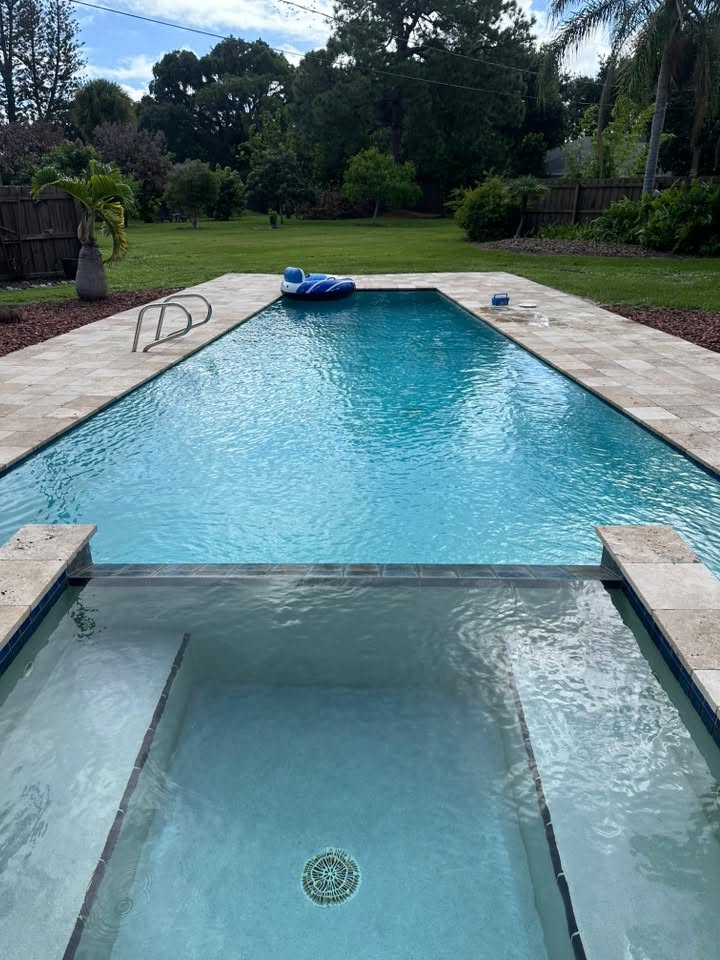 Backyard pool and shallow sun shelf, shared by Ryan’s Pool Care
